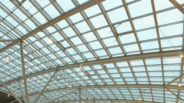 Glass Roof of a Modern Building. Overlapping Roof of the Building