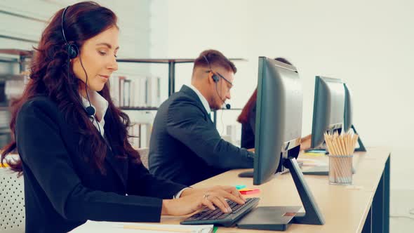 Business People Wearing Headset Working in Office alt