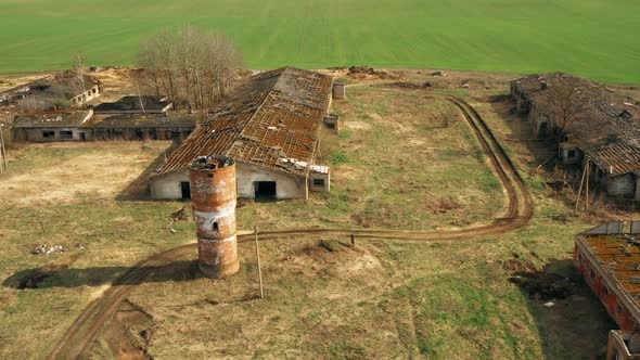 Aerial View Of Abandoned Ruined Water Tower Near Farm In Chernobyl Zone.