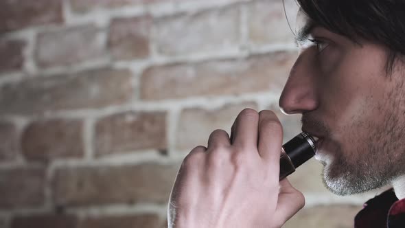 Stylish and Elegant Man in a City with Vape alt