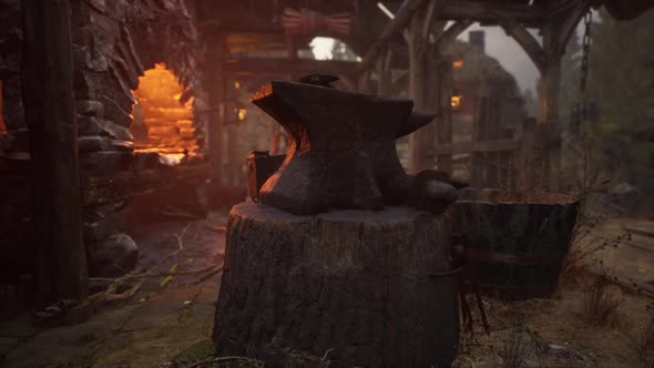 Blacksmiths Tools Hammer and Anvil in Old Blacksmiths Workshop alt