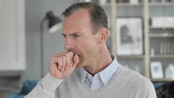 Cough Portrait of Sick Middle Aged Man Coughing at Work alt