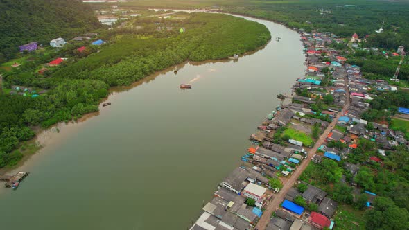 Aerial Shot of Local Fisherman Village Beside the sea. alt