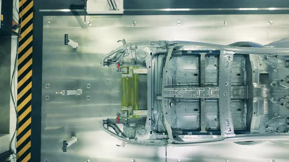 Top View of Car Body Framework. Automotive Factory Equipment. alt