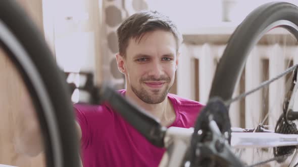 Satisfied Cyclist Enjoys Technical Condition of Bike alt