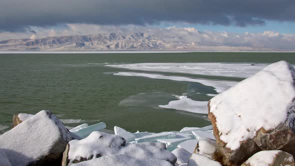 Utah Lake in winter as wind is blowing with ice on the water alt
