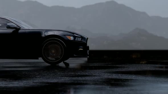 Luxury Black Sports Car Driving On Wet Asphalt