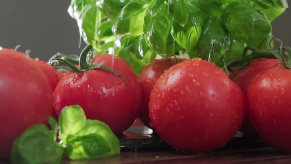 Fresh Ripe Red Tomatoes And Green Basil Leaves.