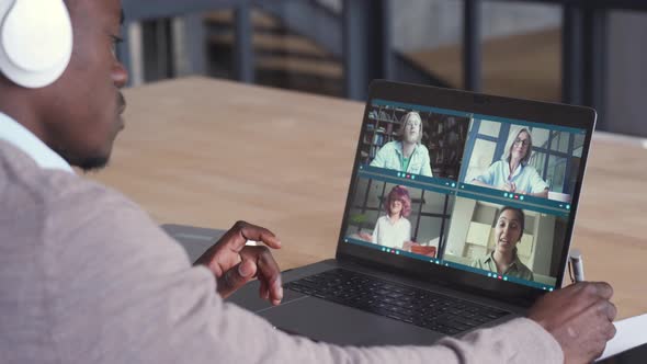 African Businessman Having Virtual Team Meeting on Video Conference Call alt