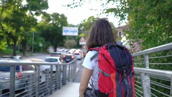 Female tourist with backpack alt