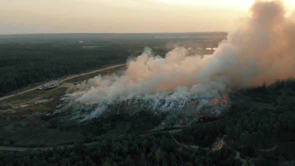 Aerial View at Fire at Garbage Dump, Burning Pollutes the Environment. Ecological Catastrophe and alt