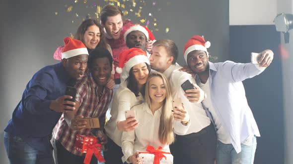 Smiling Group Of Friends Celebrate Evening Event With Selfie At Christmas Party