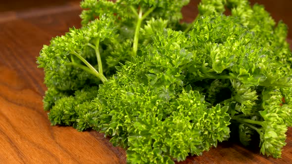 Green Salad. Parsley on a Cutting Board Close-up. Vegetarian Food.