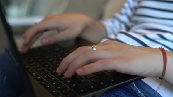 Woman Typing On Laptop