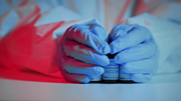 Doctor holding vaccine of new coronavirus. alt