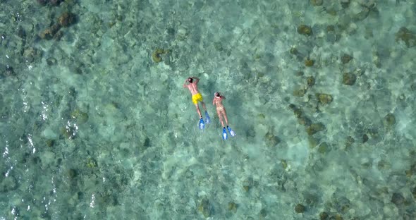 Romantic couple on romantic honeymoon enjoy life on beach on white sand 4K background alt