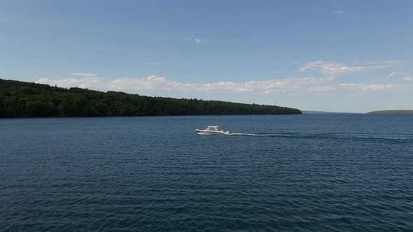 Boat sailing into Bayfileld Wisconsin aerial view summer time alt