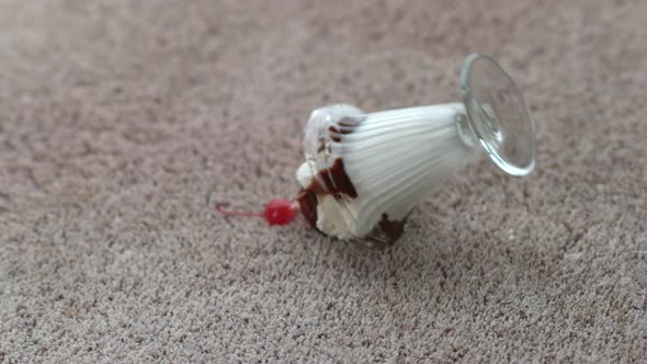 Ice cream sundae spilling on carpet in slow motion; shot on Phantom Flex 4K at 1000 fps alt