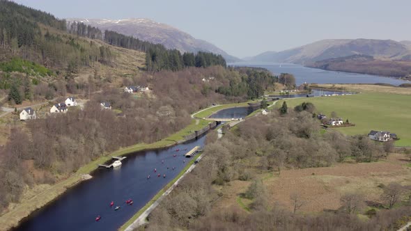 A Large Group of Canoeists Readying to Traverse a Canal Lock alt