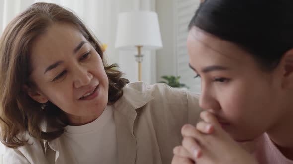 Asian family young woman problem empathy consoling mental health talk.