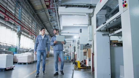 specialist worker engineer team control and operate printing package lable machine alt