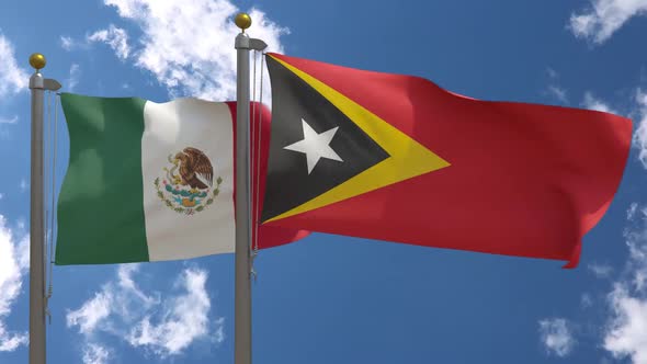 Mexico Flag Vs East Timor Flag On Flagpole alt