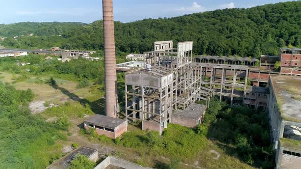 Exterior Abandoned Factory Hall In Loznica Serbia Chimneys Aerial Drone Shot Orbiting 02