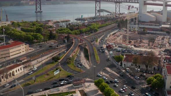Cars Driving on the Road in a Busy Intersection By the Shoreline of Portugal Coast in Lisbon alt