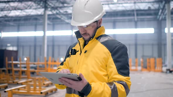 Portrait of Professional Heavy Industry Engineer / Worker Wearing Safety Uniform,  alt