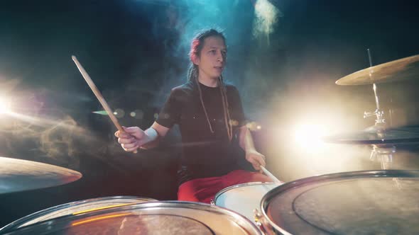 Male Drummer Is Hitting the Drum Set Rhythmically alt