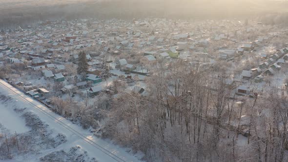 Winter country landscape with timber fence and snowy road. alt