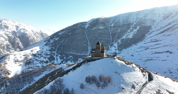 Aerial view of Gergeti Trinity Church, Tsminda Sameba in Kazbegi. Georgia 2022 alt