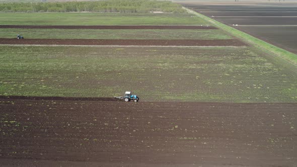 Tractor Plows Farm Land alt
