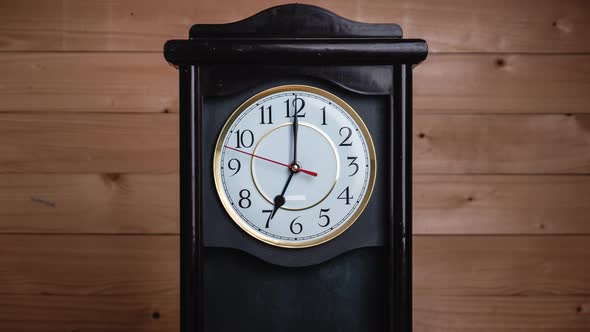 Timelapse of Full Turn of Time Hands at 7 AM or PM on Vintage Clock alt