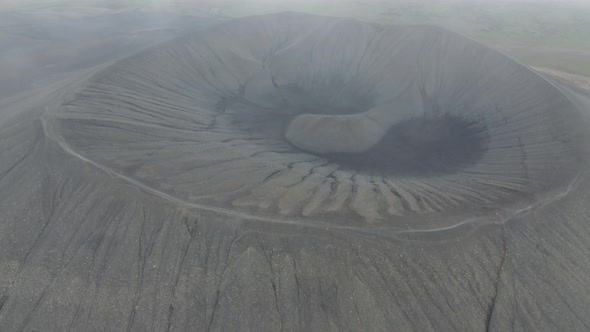 Flying in the clouds above Hverfjall volcano, Myvatn, Iceland alt