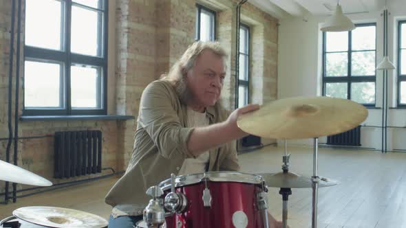 Mature Drummer Replacing Hi-Hat alt