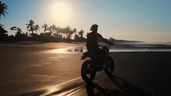 Biker on the Beach at Sunset alt