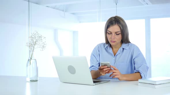 Busy Young Woman Using Smartphone, Typing Message alt