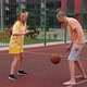 Happy Father and Teenage Daughter Playing Basketball Outside at Court - VideoHive Item for Sale