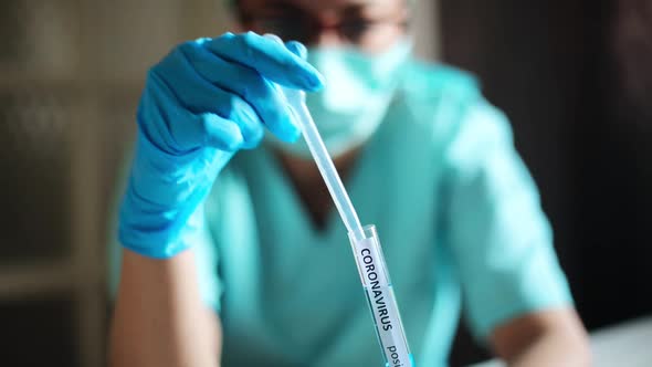 Doctor taking samples from coronavirus COVID-19 test tube