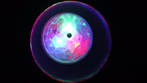 Stage Light Rotating With Multicolor Lights At Night. - close up alt