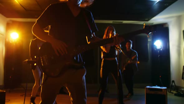 Band performing in studio alt