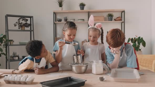 Diverse Kids Sifting Flour in Kitchen alt