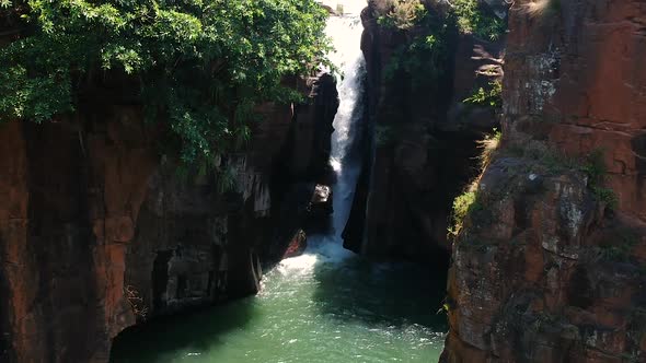 Aerial Drone Shot of A River with A Waterfall in The Jungle of South Africa