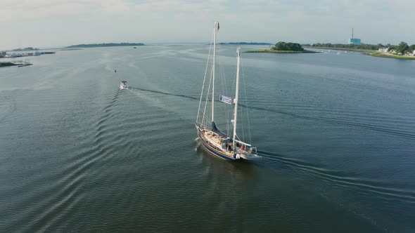 Aerial Drone Shot Orbiting a Large Sailboat in a Quiet Harbor (Norwalk, Connecticut)