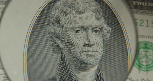 Two Us Dollars Cash Macro View. $ 2 Cash. Under A Magnifying Glass. One Hundred Dollars Close Up. alt