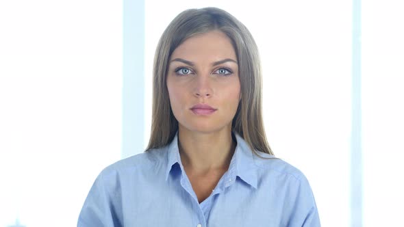 Beautiful Woman Sitting in Office, Looking at Camera alt