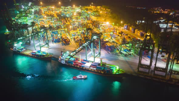 Aerial view, working in the import-export port, complete with bulk cargo containers during dusk,