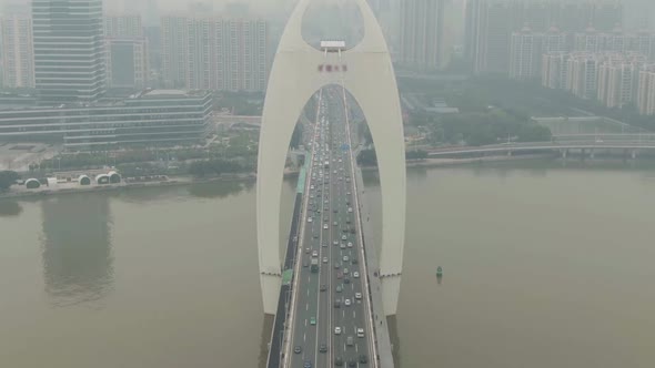 Liede Bridge on Pearl River. Guangzhou City in Smog, China. Aerial View alt