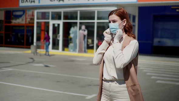 Young Female Shopper Puts on Medical Mask and Gloves To Protect Against Dangerous Deadly Virus in alt